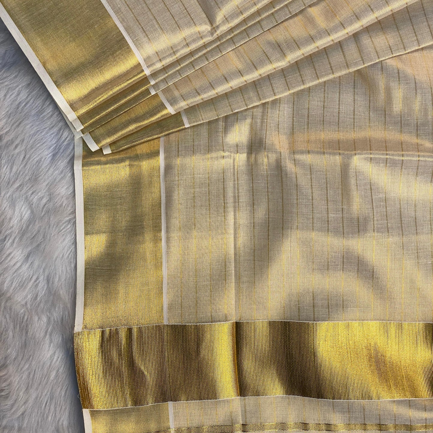 Tissue Kerala Saree with with Lines and thick Border Golden