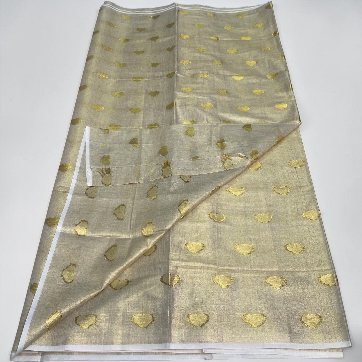 Kerala Style Cream Saree with Golden Jaggad Butta Design
