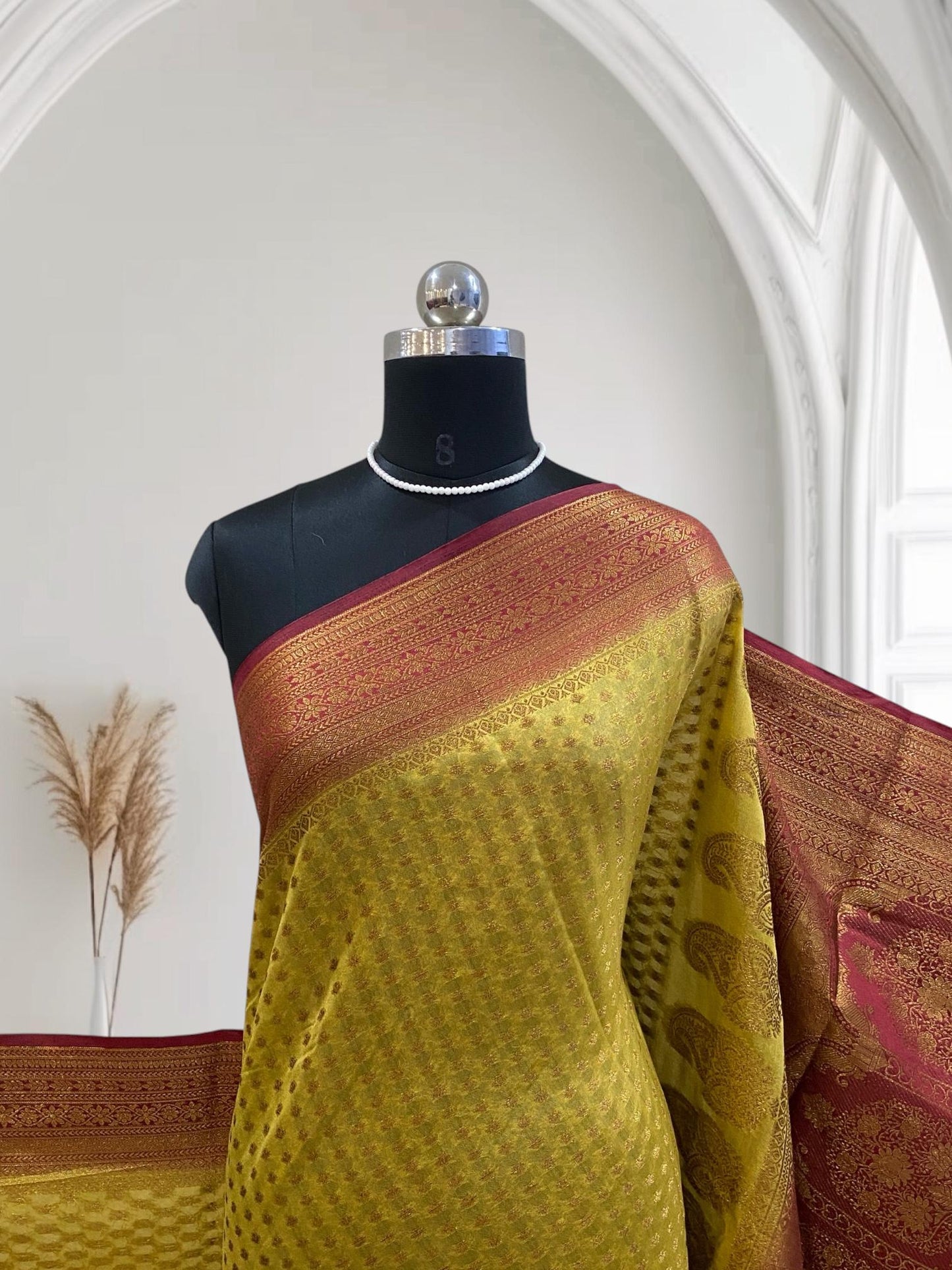Sheena Olive Green Georgette Saree with Zari Butta & Contrast Border