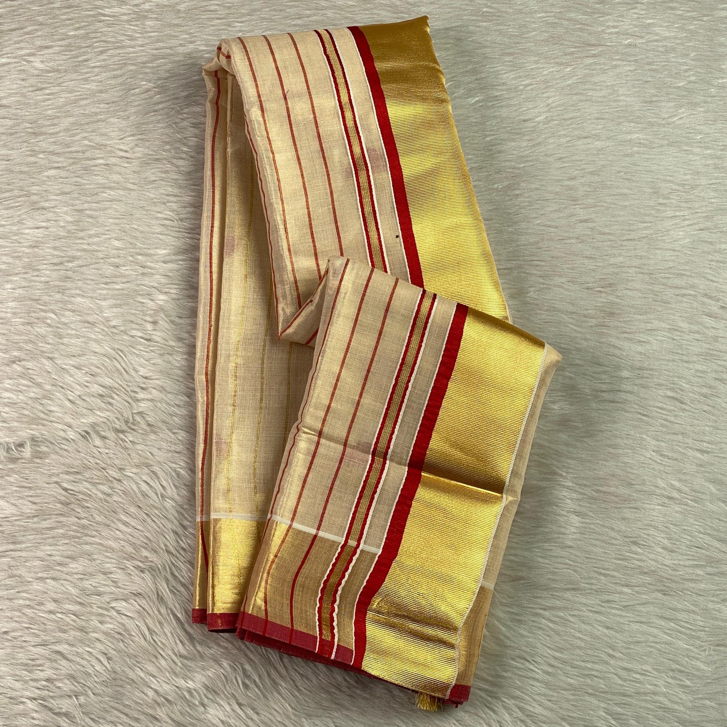 Shobana Uthradam Tissue Kerala Saree with Golden Lines and Butta work Red