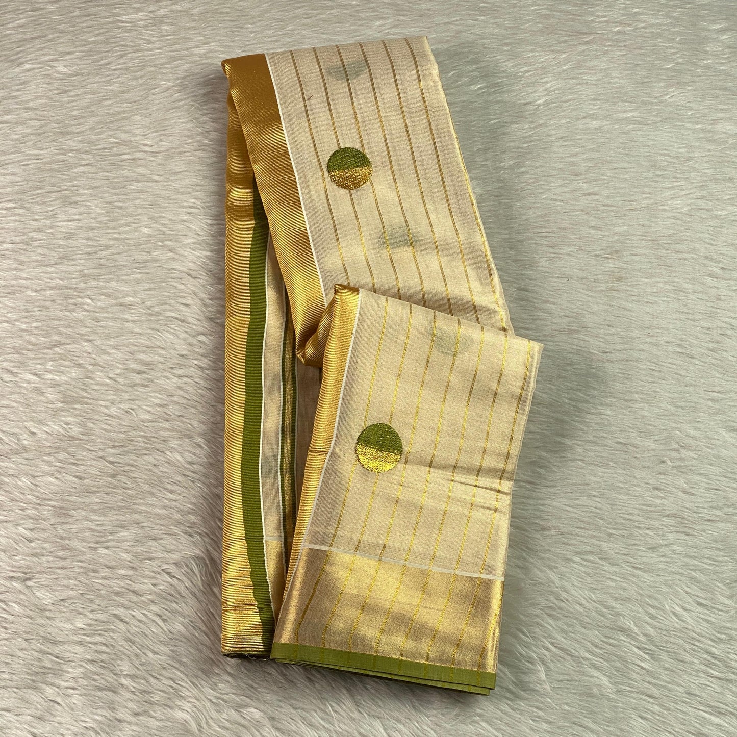 Shobana Uthradam Tissue Kerala Saree with Golden Lines and Butta work Green