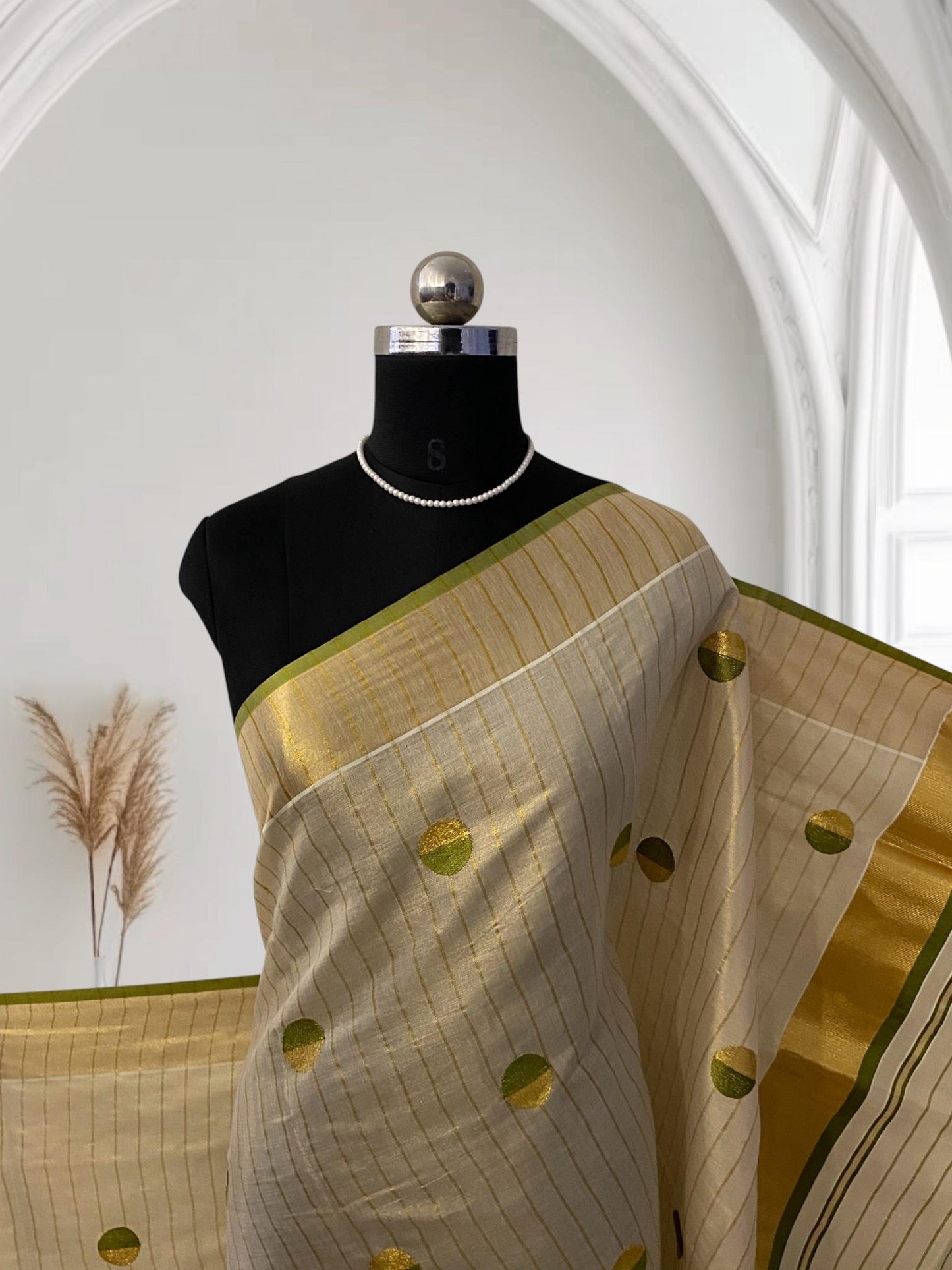 Shobana Uthradam Tissue Kerala Saree with Golden Lines and Butta work Green