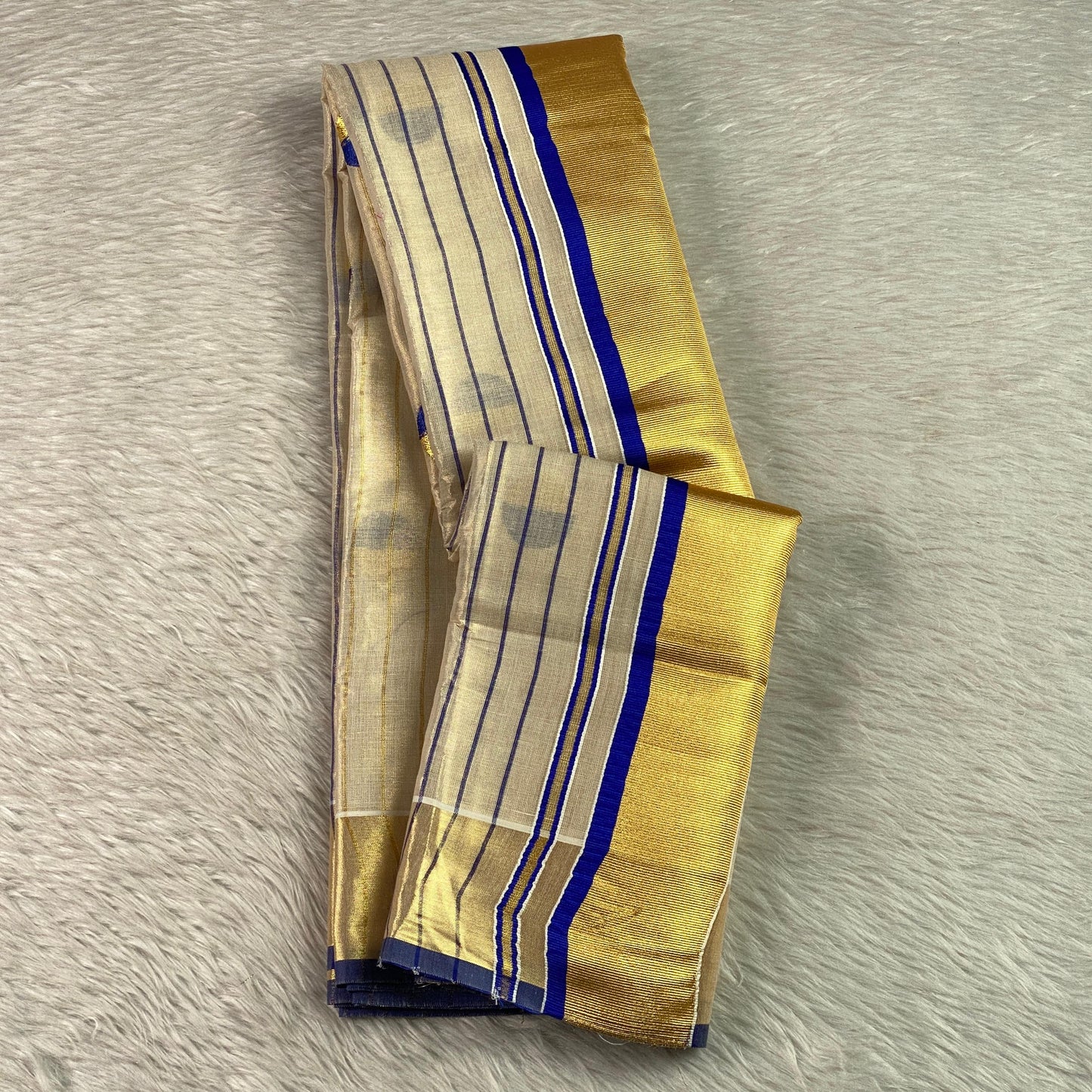 Shobana Uthradam Tissue Kerala Saree with Golden Lines and Butta work Green