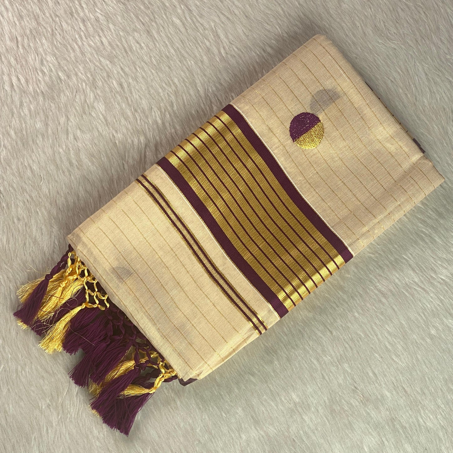 Shobana Uthradam Tissue Kerala Saree with Golden Lines and Butta work Purple