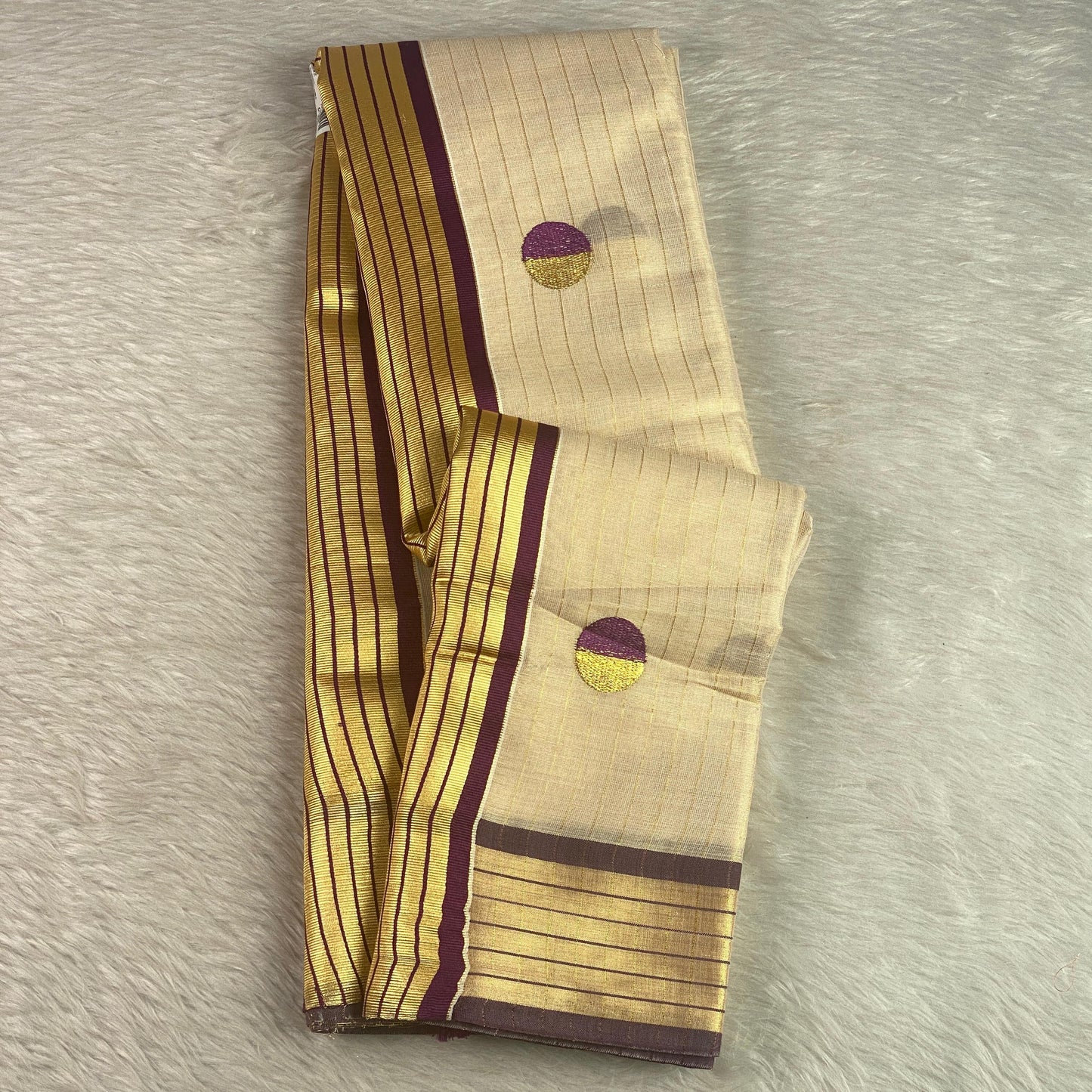 Shobana Uthradam Tissue Kerala Saree with Golden Lines and Butta work Purple