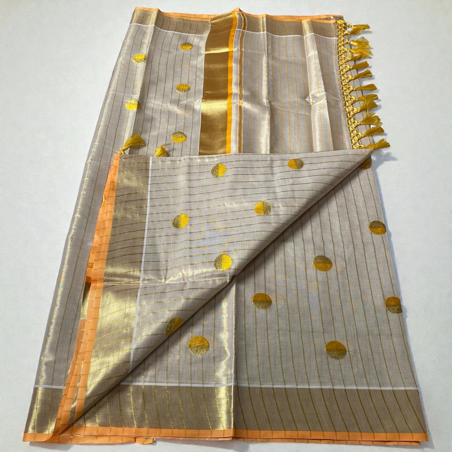 Shobana Uthradam Tissue Kerala Saree with Golden Lines and Butta work Yellow