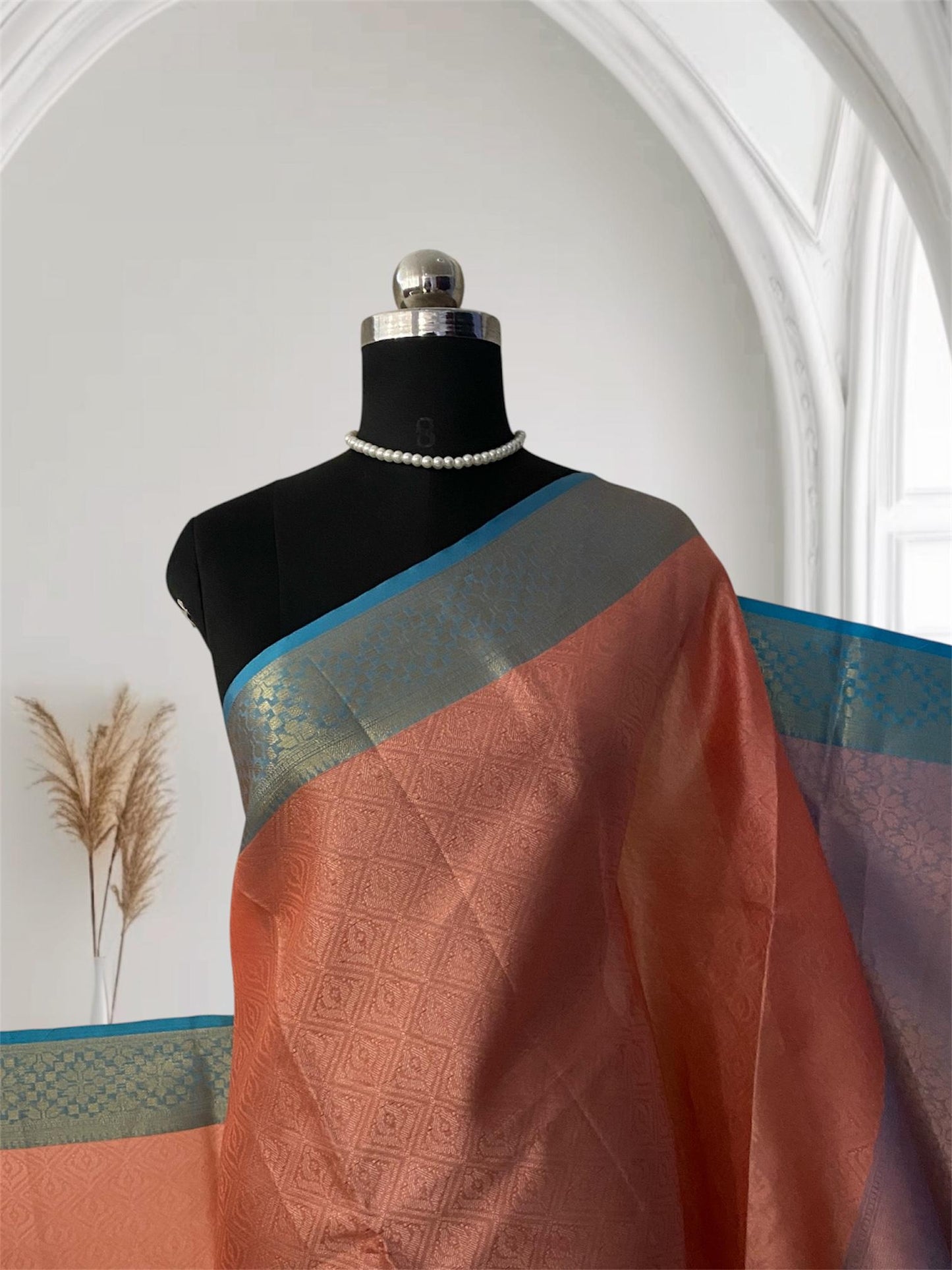 Devanshi – Premium Orange Silk Saree with Rich Blue Zari Border