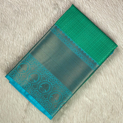 Devanshi – Premium Green Silk Saree with Rich Blue Zari Border