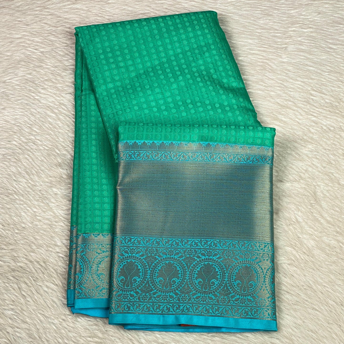 Devanshi – Premium Green Silk Saree with Rich Blue Zari Border