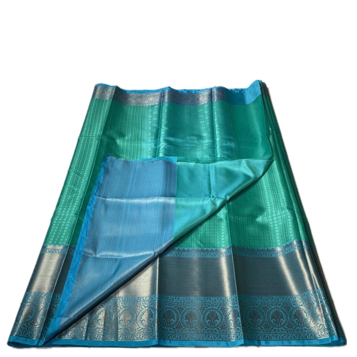 Devanshi – Premium Green Silk Saree with Rich Blue Zari Border
