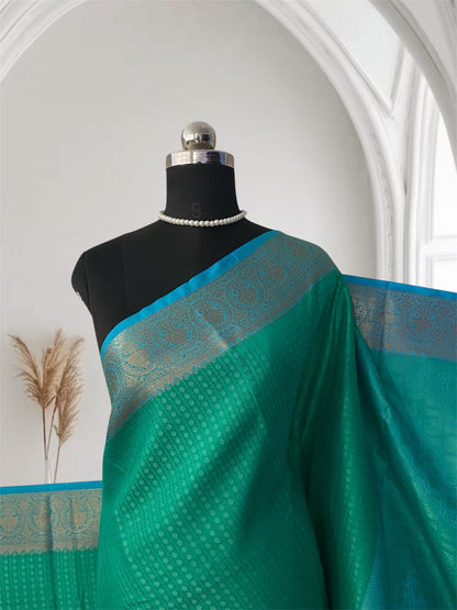 Devanshi – Premium Green Silk Saree with Rich Blue Zari Border