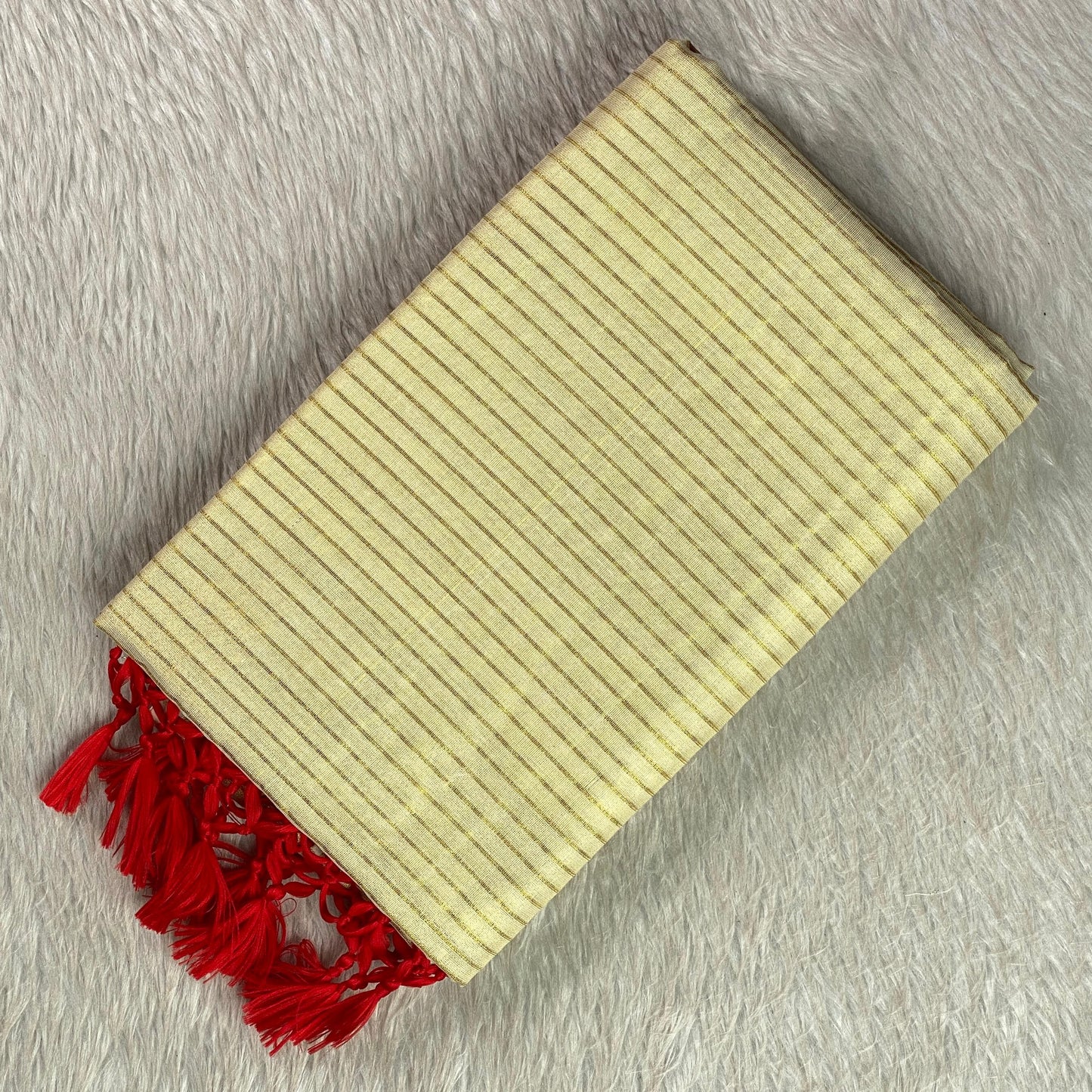 Tissue Kerala Saree with Stipes and Red Tassels