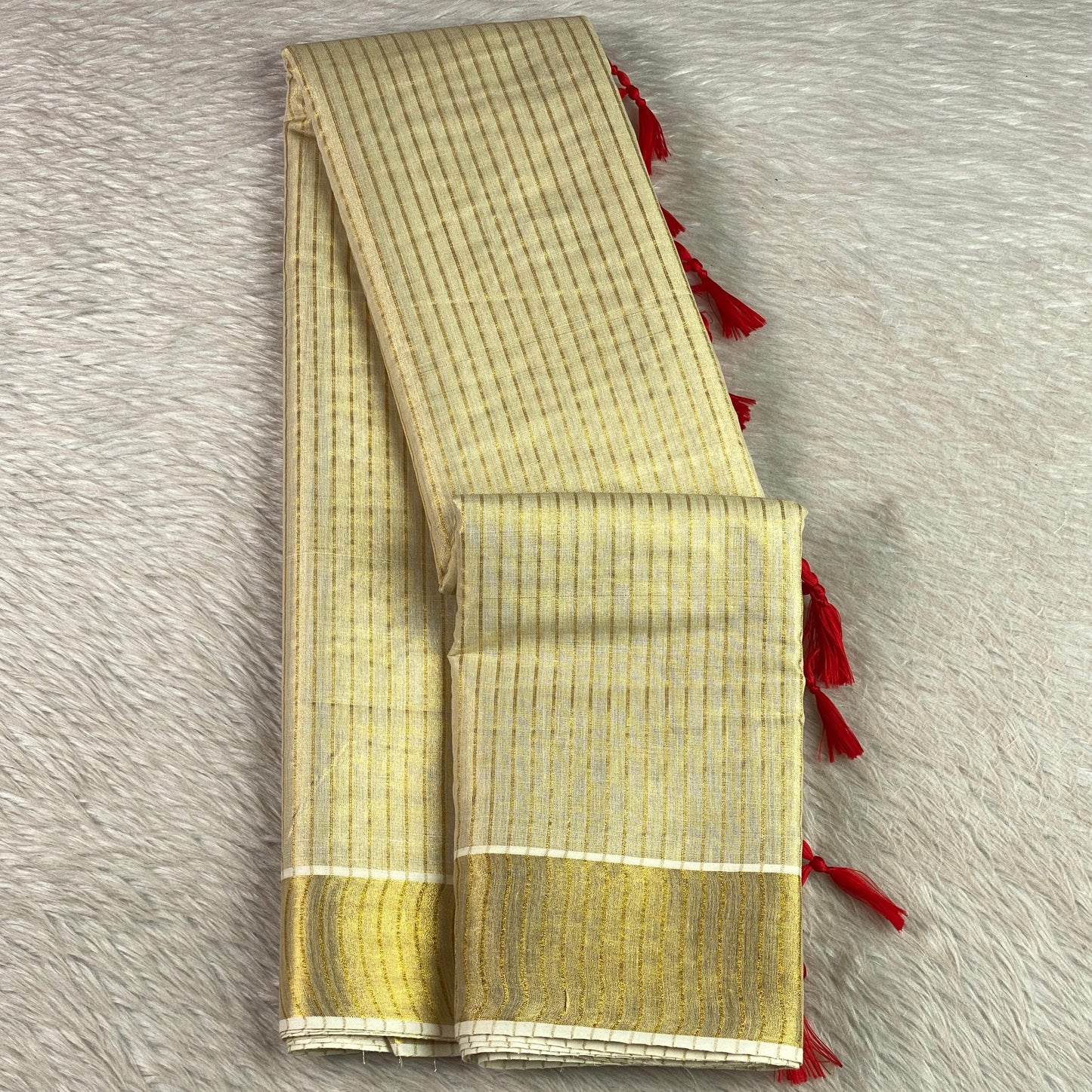 Tissue Kerala Saree with Stipes and Red Tassels