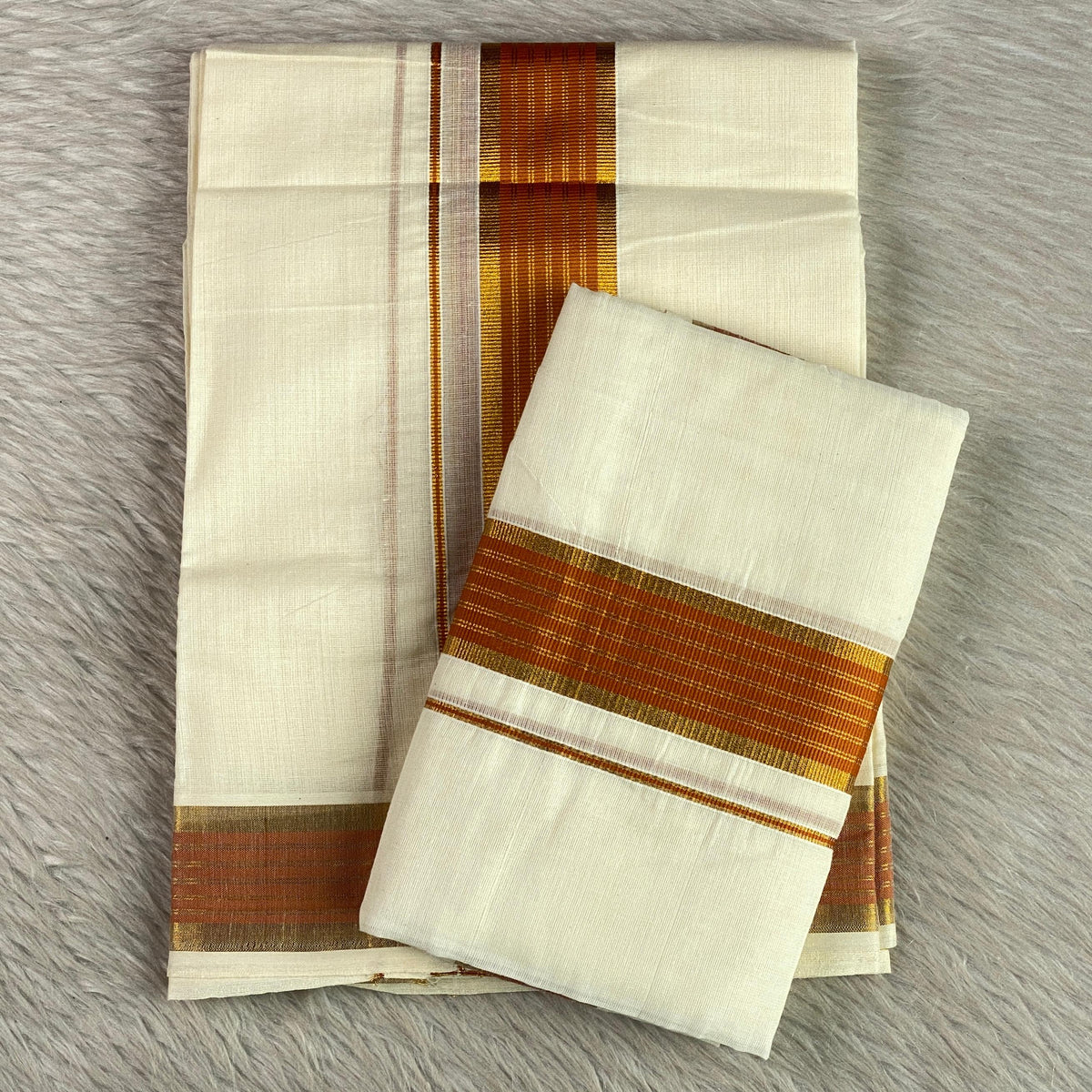 Kashi Kerala Kasavu Mundu with Orange & Golden Zari Border. 🌿✨