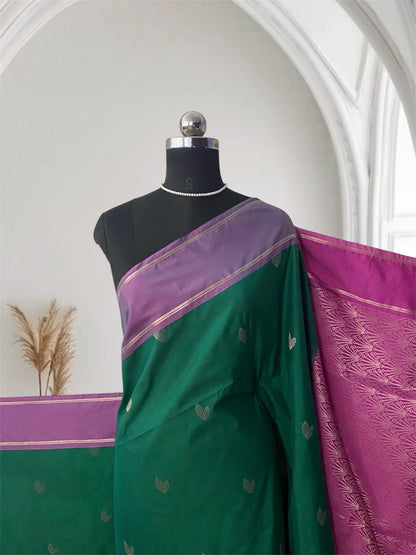Green Kanchipuram Silk Saree with Pink Border